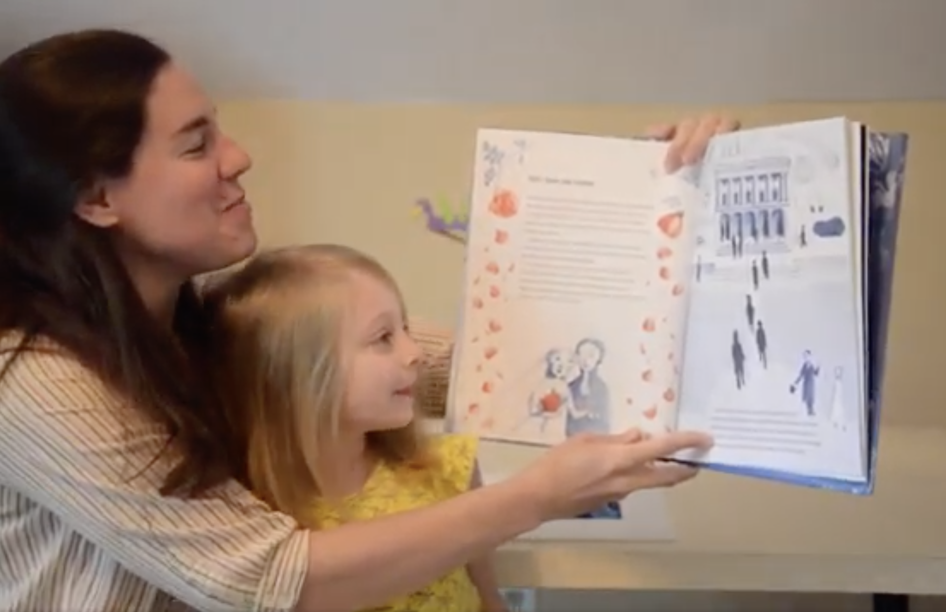 Emily and Edna reading a book