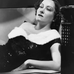 Old film actress Gloria Swanson lounging 