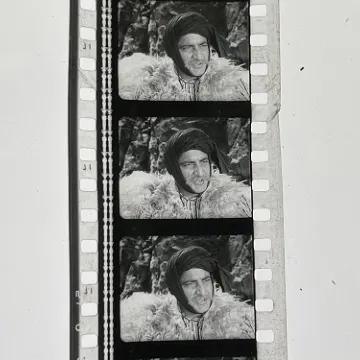 35mm film fragment depicting a man in fur.