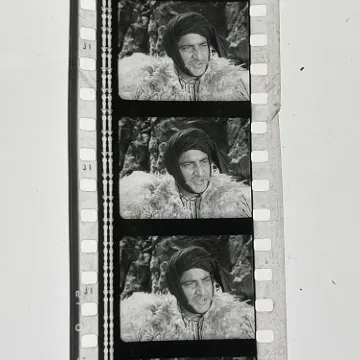 35mm film fragment depicting a man in fur.