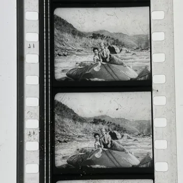 35mm film fragment depicting Rangeela on a rock.