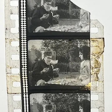 35mm film frames depicting man and woman talking