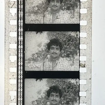 35mm film frames depicting man looking at camera.