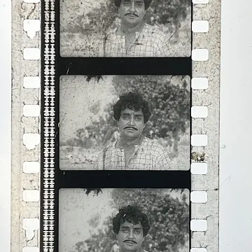 35mm film frames depicting man looking at camera.