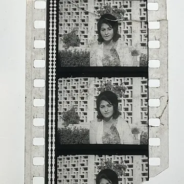 35mm film frames depicting woman looking at camera.