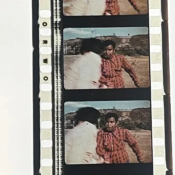 35mm film fragment depicting a fight scene.
