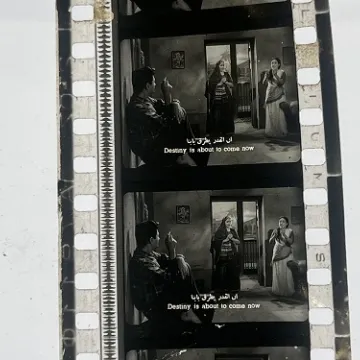 35mm film frames depicting women yelling at man.