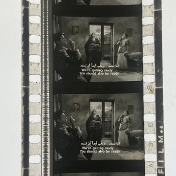 35mm film frames depicting women yelling at man.