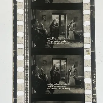 35mm film frames depicting women yelling at man.