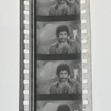 35mm film frames depicting man in paisley shirt.