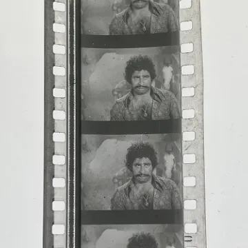 35mm film frames depicting man in paisley shirt.