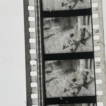 35mm film frames depicting two men fighting.