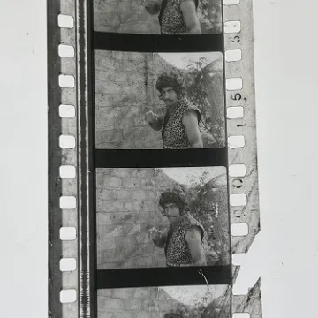 35mm film frames depicting man in leopard print.