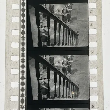 35mm film fragment depicting a man cleaning.