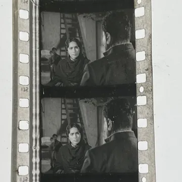 35mm film frames depicting woman talking with man.