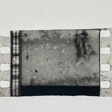 35mm film fragment depicting a man on a horse.
