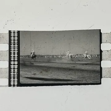35mm film fragment depicting a man on a horse.