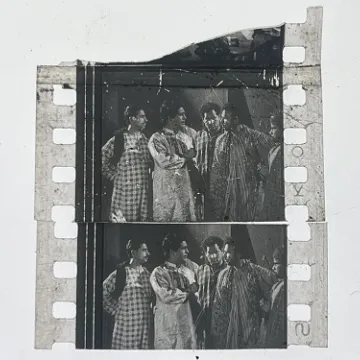35mm film frames depicting man with friends.