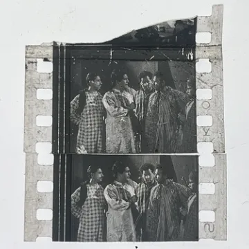 35mm film frames depicting man with friends.