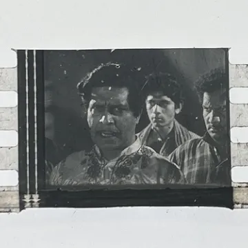 35mm film frames depicting man with friends.