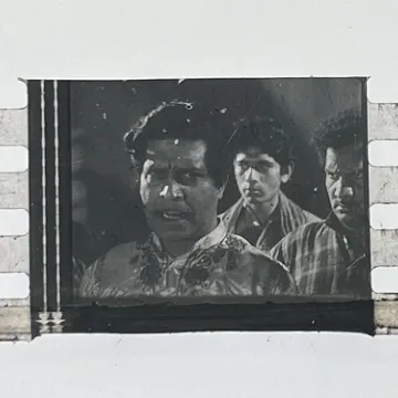 35mm film frames depicting man with friends.