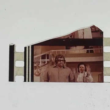 35mm film fragment depicting man and woman.
