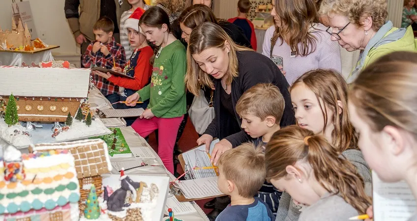 Kids looking at gingerbread houses