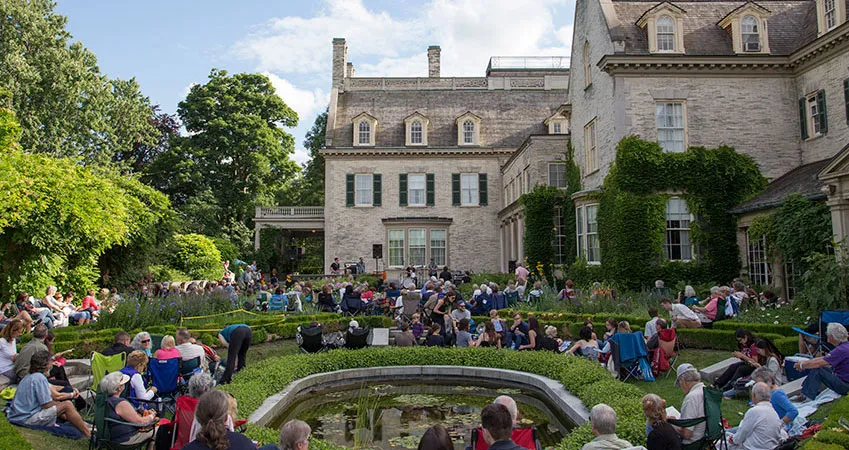 View of the mansion from the Townson Terrace garden during a garden concert