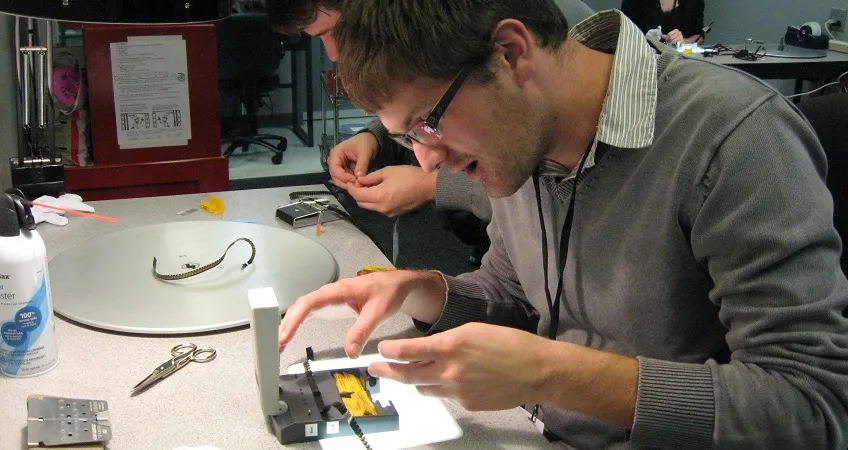 Students inspecting a print