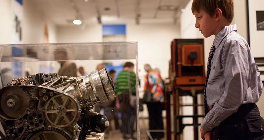 Boy looking at a camera display