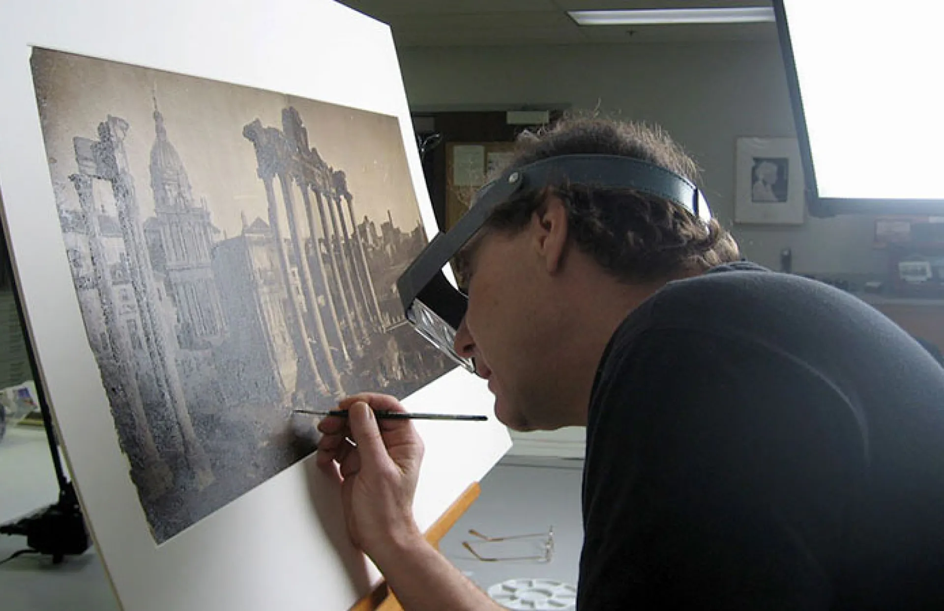 Conservator working on photograph