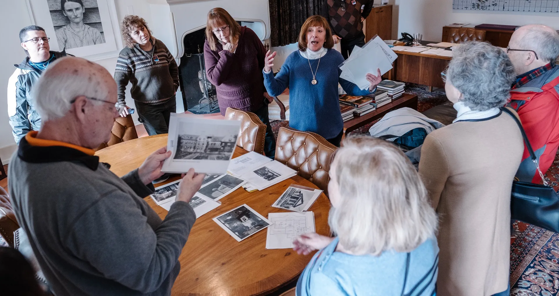 Members on a tour of the upstairs of the mansion