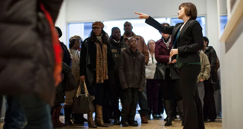 Group tour of a photography gallery