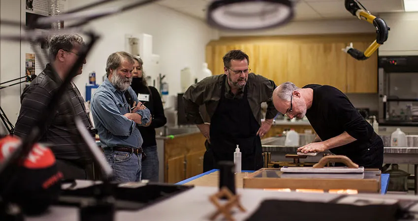 Visitors participate in a historic process workshop