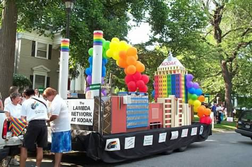 Lambda Network members, including Emily Jones on left and Pam Barres on rights, prepare to march in the 2002 Pride Parade in Rochester. The buildings on the float represent major Kodak facilities including the smokestacks of Kodak Park, Building 23, Building 28 (now Theater on the Ridge) and Kodak Tower, the widows of which were made from pieces of film. Lambda won the Stonewall Award from the Gay Alliance of the Genessee Valley for the not-for-profit group that most imaginatively depicts the year's parade 