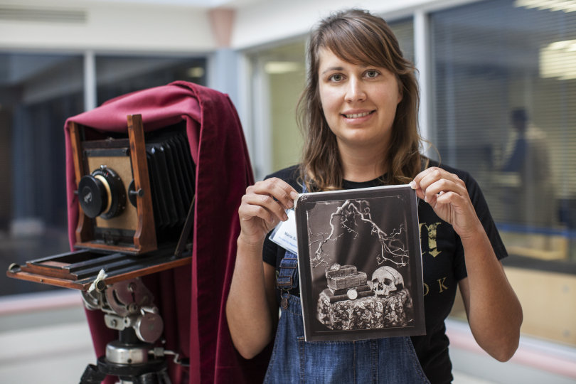 Woman holding a salted paper print