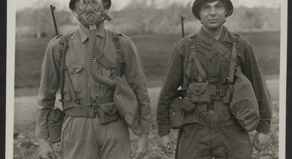 Two Students Demonstrate the Importance of Eye Shields and Gas Masks at a Gas School in Northern Ireland, January 14, 1944.