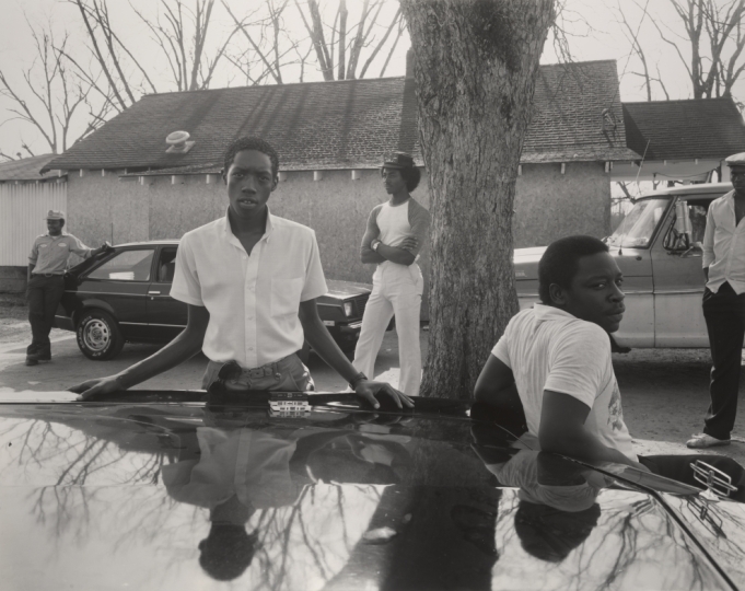 Black Americans from the 1950s in front of a car 