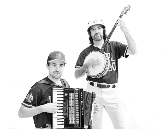 Two people playing a banjo and accordion 