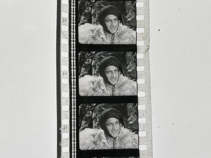 35mm film fragment depicting a man in fur.