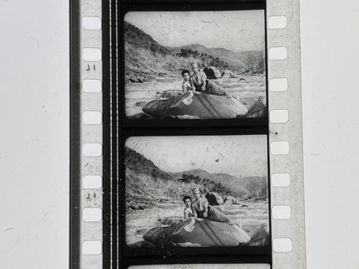 35mm film fragment depicting Rangeela on a rock.