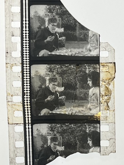 35mm film frames depicting man and woman talking