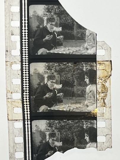 35mm film frames depicting man and woman talking