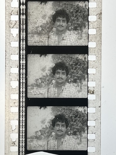 35mm film frames depicting man looking at camera.