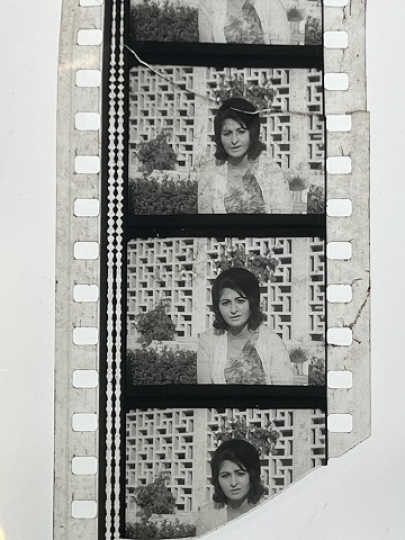 35mm film frames depicting woman looking at camera.