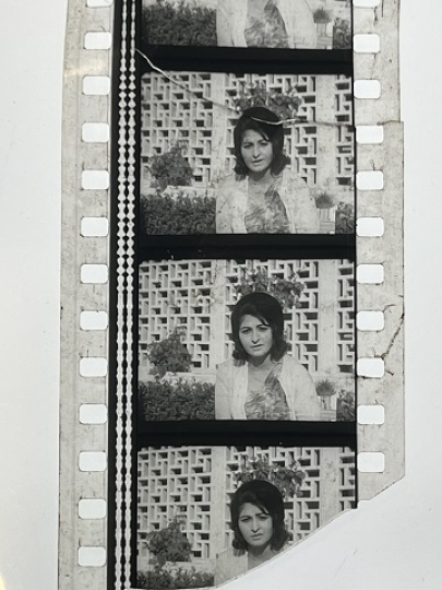 35mm film frames depicting woman looking at camera.