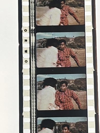 35mm film fragment depicting a fight scene.