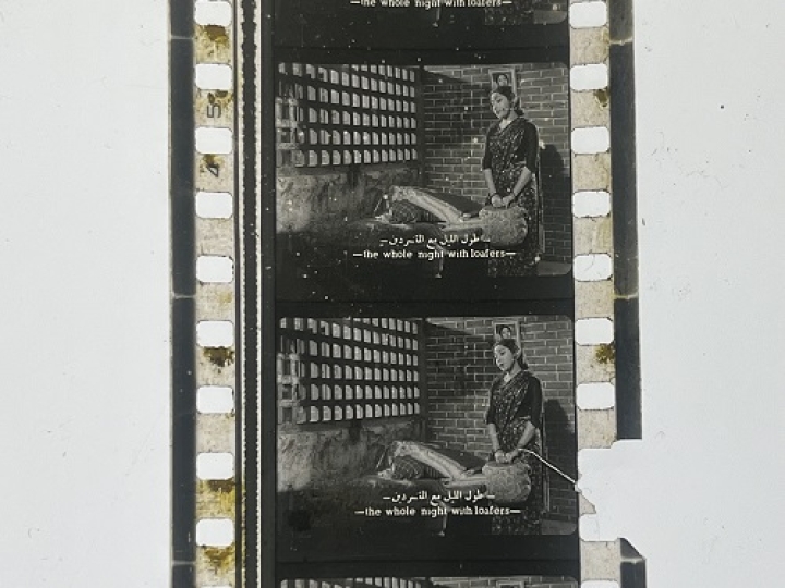 35mm film frames depicting woman in bedroom.