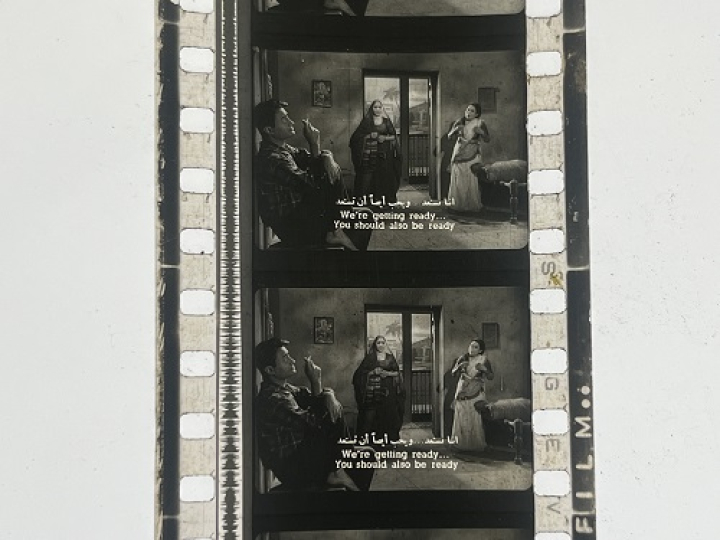 35mm film frames depicting women yelling at man.