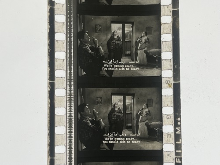 35mm film frames depicting women yelling at man.